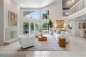 Serene lake views, sunlit living spaces, and a private backyard for sale in Delray Beach Florida Palm Beach County County on GolfHomes.com
