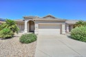 Lovely home located in Arizona Traditions, a Gated 55+ for sale in Surprise Arizona Maricopa County County on GolfHomes.com