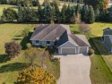 Recreation abounds right off the green in this outstanding 4+ for sale in Waupaca Wisconsin Waupaca County County on GolfHomes.com