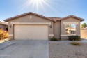 This single-level, 4-bedroom, 3-bath home with a bonus for sale in Maricopa Arizona Pinal County County on GolfHomes.com