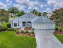 BOND PAID! Lovely 3 Bedroom, 2.5 Bathroom CYPRESS DESIGNER home for sale in The Villages Florida Sumter County County on GolfHomes.com