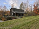 Check out this 3-bedroom, 1-bathroom log home! Featuring a cozy for sale in Nicholson Pennsylvania Wyoming County County on GolfHomes.com